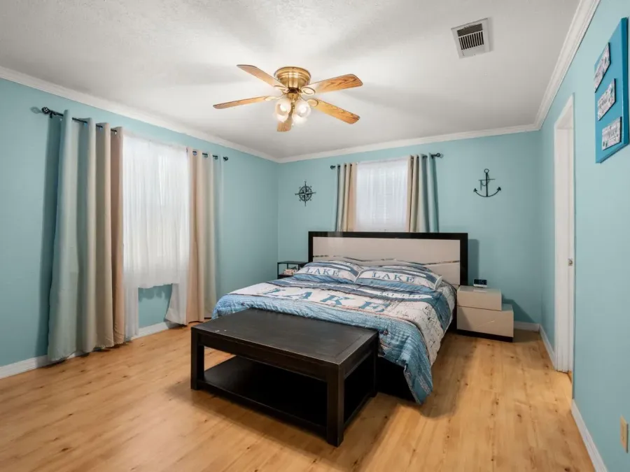 The master bedroom has a king size bed.